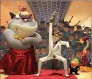  ?? DREAMWORKS ANIMATION VIA AP ?? Shark, voiced by Craig Robinson, left, Wolf, voiced by Sam Rockwell, Piranha, voiced by Anthony Ramos, center, and Snake, voiced by Marc Maron, appear in the film, ‘The Bad Guys.’