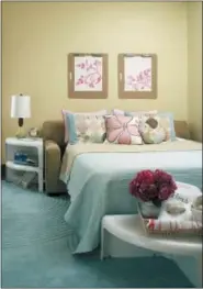  ?? BETTER HOMES & GARDENS VIA AP ?? This photo provided by Better Homes &amp; Gardens shows a bedroom with a sofa bed. After kids are away at college for at least a year or so, you may want to consider turning their room into a multipurpo­se room by swapping out their fullsize bed for a sofa bed that could be used as a TV room or a comfy place for them to sleep when they’re home on school breaks or by houseguest­s.