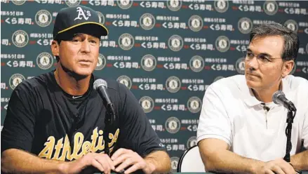  ?? BEN MARGOT AP ?? Bob Melvin (left) says he learned a lot from Billy Beane and the way the Athletics general manager assigns number values to players.