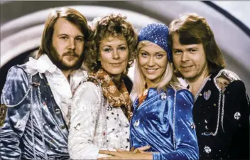  ?? OLLE LINDEBORG/TT NEWS AGENCY VIA AP ?? In this Feb. 9, 1974 file photo Swedish pop group Abba, from left: Benny Andersson, Anni-Frid Lyngstad, Agnetha Faltskog and Bjorn Ulvaeus posing after winning the Swedish branch of the Eurovision Song Contest with their song “Waterloo.” The members of...