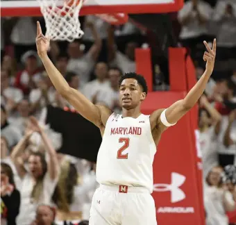  ?? AP ?? CO-CHAMPS: Maryland guard Aaron Wiggins (2) reacts after a made basket Sunday. Maryland earned a share of the Big Ten regular-season crown.