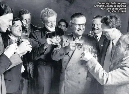  ??  ?? Pioneering plastic surgeon Archibald McIndoe celebratin­g with some of the Guinea Pig Club in 1948
