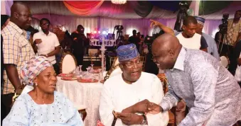  ??  ?? Wife of former governor of Lagos State, Alhaja Jakande and First governor of Lagos State Sir Mobolaji Johnson with Ambode