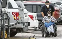  ?? Jon Shapley / Staff photograph­er ?? A person is loaded into an ambulance April 8 outside the La Porte Healthcare Center, which had a coronaviru­s outbreak.