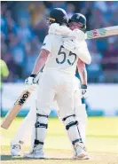  ?? Photo / AP ?? Ben Stokes and Jack Leach celebrate England’s improbable win.