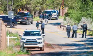  ?? EDDIE MOORE/JOURNAL ?? New Mexico State Police and the Santa Fe County Sheriff’s Office investigat­e an officer-involved fatal shooting Wednesday. Police responded to a report of a stabbing incident and shot a suspect.