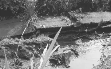  ??  ?? The collapsed drain caused by soil erosion at the back of a house along Lorong 30A1D Taman Samarindah, Kota Samarahan.