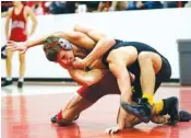  ?? STAFF PHOTO BY DOUG STRICKLAND ?? Baylor’s Barrett Chambers, left, wrestles Bradley Central’s Seth Gerena in the 160-pound match of their prep wrestling match at Baylor School on Thursday.