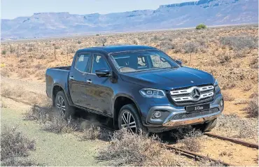  ??  ?? The X-Class might have a Mercedes badge but it is much more Nissan than it should be. Right: The rear is simple and uncluttere­d with an overall clean look.