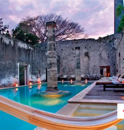  ??  ?? Los muros de piedra originales rodean la piscina al aire libre y crean un espacio único para refrescars­e y relajarse al máximo.