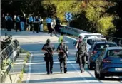  ?? EMILIO MORENATTI/AP ?? Police patrol Monday near Subirats, where officers shot and killed the lone fugitive from last week’s van attack.