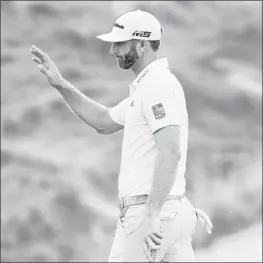  ?? JARED C. TILTON/GETTY-AFP ?? Dustin Johnson reacts following a putt on the 15th green during Friday’s second round of The Northern Trust at Liberty National Golf Club in Jersey City, NJ.