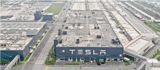  ?? Liu Ying/Associated Press ?? The Tesla Gigafactor­y in the Lingang area of the China Pilot Free Trade Zone is seen in east China.