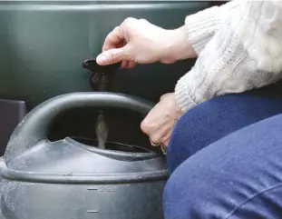  ??  ?? A rainwater-collection system can be as simple as a rain barrel at the end of a downspout.