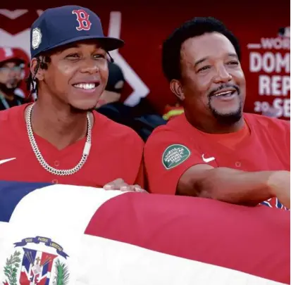  ?? FILE/DANIELLE PARHIZKARA­N/GLOBE STAFF ?? Brayan Bello did not get to pitch recently in his native Dominican Republic, but he was happy to watch one of the games against the Rays alongside Pedro Martinez.