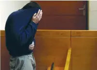  ?? (Baz Ratner/Reuters) ?? THE TEENAGER SUSPECTED of making bomb threats against Jewish community centers in the US and around the world is seen before the start of his remand hearing at the Rishon Lezion Magistrate’s Court on March 23.