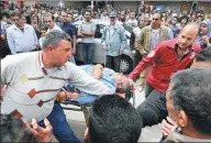  ?? REUTERS ?? A victim is seen on a stretcher after a bomb went off at a Coptic church in Tanta, Egypt, on Sunday.