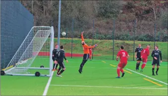  ?? Oban Saints’ match reports and photograph: Derek Black. ?? Myles McAuley’s header flies into the South Lochaber Thistle net past a helpless Andrew Brown.