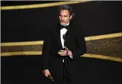  ?? KEVIN WINTER — GETTY IMAGES ?? Joaquin Phoenix accepts the best actor Oscar for “Joker” during the 92nd Annual Academy Awards on Feb. 9.