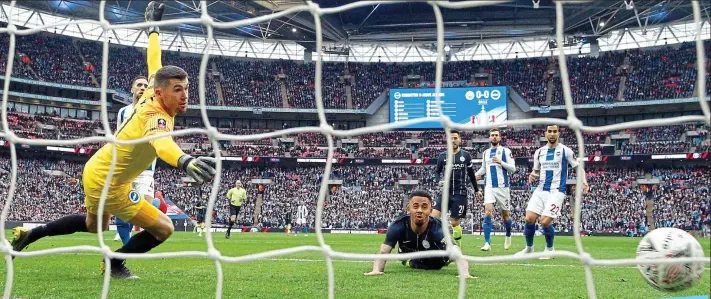  ?? AP ?? Dousing the fire: Jesus’ early goal killed off any hope of a Brighton upset at Wembley