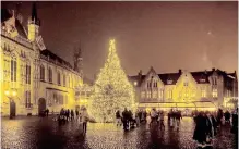  ?? | Instagram ?? A TOWN square in Bruges with a wonderfull­y lit Christmas tree.