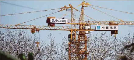  ?? BLOOMBERG PIC ?? Sunac China Holdings is tapping multiple financing channels offshore after its credit risks came under scrutiny in China following a string of high-profile purchases.