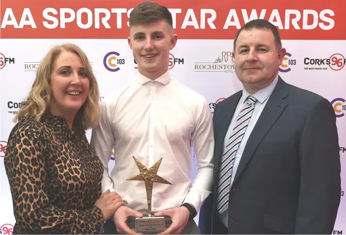  ??  ?? Clyda Rovers Conor Corbett won the Young GAA Sports Star of the Year Award in the company of parents Marie and Michael at a function in the Rochestown Park Hotel, Cork.
Photo by John Tarrant