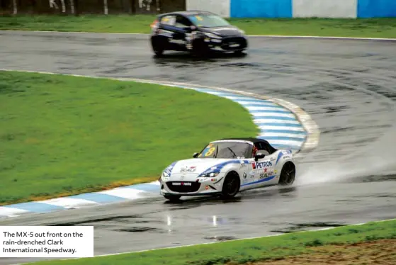  ??  ?? The MX-5 out front on the rain-drenched Clark Internatio­nal Speedway.