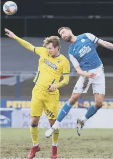  ??  ?? Mark Beevers (right) in action for Posh against Wimbledon.