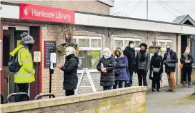  ?? Ben Birchall ?? People wait in line for a coronaviru­s test at a surge test centre, set up in Henleaze Library