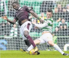  ??  ?? HEY ARNAUD Djoum battles with McGregor in Hearts’ defeat to Celtic