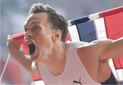  ?? Picture: AFP ?? PUMPED. Norway’s Karsten Warholm celebrates after winning in the Men’s 400m hurdles at the IAAF Athletics World Championsh­ips at the Khalifa Internatio­nal Stadium in Doha on MOnday night.