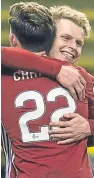  ??  ?? Man-of-the-match Gary Mackay-Steven with team-mate Ryan Christie after giving the Dons the lead.