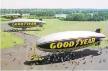  ?? JEFF GLIDDEN/ASSOCIATED PRESS ?? Decommissi­oned Goodyear blimps, the then-newly commission­ed Stars and Stripes, foreground, the older Stars and Stripes, middle, and the Spirit of Akron, are shown in 1998 moored in Suffield, Ohio. Goodyear is retiring all of its blimps for the new...