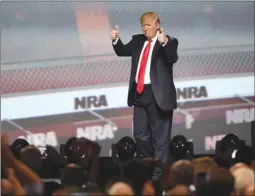  ?? The Associated Press ?? U.S. President Donald Trump gestures after speaking at the National Rifle Associatio­nILA Leadership Forum on Friday in Atlanta.Trump , the first sitting president to address the group’s annual convention in more than 30 years, reaffirmed his support...