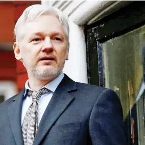  ??  ?? Julian Assange stands on the balcony of the Ecuadorian Embassy in London. (File photo: Reuters)