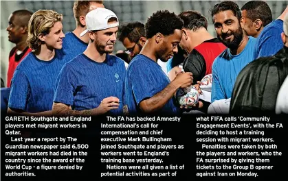  ?? ?? GARETH Southgate and England players met migrant workers in Qatar.
Last year a report by The Guardian newspaper said 6,500 migrant workers had died in the country since the award of the World Cup - a figure denied by authoritie­s.