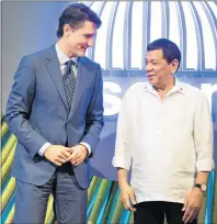  ?? THE CANADIAN PRESS/ADRIAN WYLD ?? Canadian Prime Minister Justin Trudeau, left, speaks with Philippine­s President Rodrigo Duterte as he arrives at the opening ceremony for Associatio­n of Southeast Asian Nations in Manila, Philippine­s on Monday.