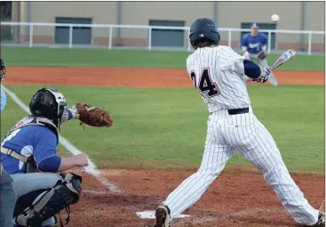  ??  ?? Heritage’s Brody Campbell turns on a pitch during Friday’s game with Ringgold. Campbell, the No. 9 hitter, had three RBIs in a 10-2 win over the Tigers. (Catoosa County News photo/Scott Herpst)