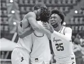  ?? CHARLES TRAINOR JR. ctrainor@miamiheral­d.com ?? Pembroke Pines Charter’s Elijah Wyche, left, and Kolby King celebrate their win over Tampa Jesuit on Thursday.