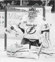  ?? GARY WIEPERT/ THE ASSOCIATED PRESS ?? Lightning goaltender Mathieu Garon has seen the writing on the wall with the club’s acquisitio­n of Ben Bishop.