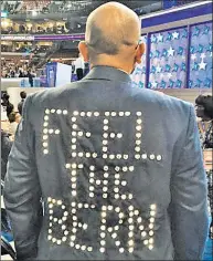  ??  ?? Time to shine: Bernie Sanders delegate Sanjay Patel lit up the convention floor this week for his candidate.