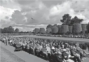  ?? PHOTOS BY JEREMIAS GONZALEZ/AP ?? Crowds of French and internatio­nal visitors attend the ceremony marking the 78th anniversar­y of D-day at the Normandy American Cemetery and Memorial of Colleville-sur-mer in France on Monday. The ceremonies pay tribute to the nearly 160,000 troops from Britain, the U.S., Canada and elsewhere who landed on French beaches on June 6, 1944, to restore freedom to Europe after Nazi occupation.