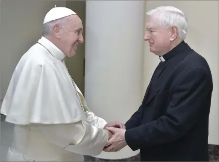  ??  ?? A special handshake....Pope Francis and Fr John O’Leary.