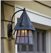  ??  ?? OLD ENGLISH COTTAGE
With its steeply pitched roof, the ‘European Country Lantern’ has that Old English cottage look popular in the bungalow and Tudor Revival eras. As shown (8" x 19.5") in verdigris patina with clear seed glass, $630; other finishes,...