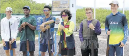  ?? ?? The AISK Junior Sporting Clays Competitio­n Super Six shooters as seen just before they begin the shoot-off to determine the overall winner on Sunday at the Jamaica Skeet Club in Portmore. (From left) Noah Vaughan, Zaniel Knght, David Wong (winner), Lori Ann Harris (runner-up), Nicholas Debellis and John Meanny.