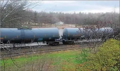  ?? PHOTO PROVIDED ?? The state has pledged legal action to force the removal of stored, unused rail cars in the Adirondack­s.