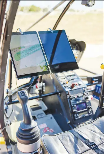  ?? ?? The joystick and two Apple ipads used with Skyryse’s Flightos system are mounted in the cockpit of a helicopter before reporter Cade Metz’s f light in Camarillo.