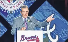  ?? HYOSUB SHIN / HSHIN@AJC.COM ?? ◄ John Schuerholz (giving his acceptance speech during a Braves Hall of Fame luncheon in 2016) now serves as vice chairman (club adviser).