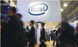  ?? (Paul Hanna/Reuters) ?? PEOPLE ARE SEEN near the Intel logo at the Mobile World Congress in Barcelona last month. Mobileye says it has 80% of the market of advanced driver-assistance systems (ADAS) that can automatica­lly apply brakes or keep a car in its lane, and Intel sees...